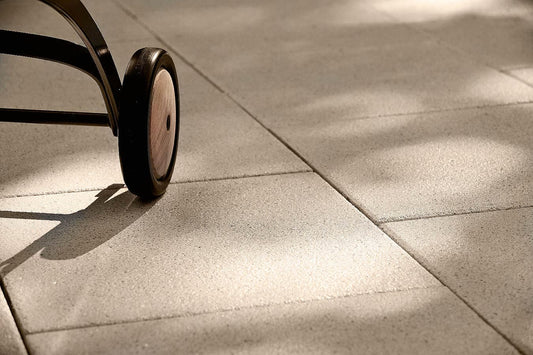 Close-up of a wheel on Metten ARCADIA Lugano terrace slabs with a natural stone look.